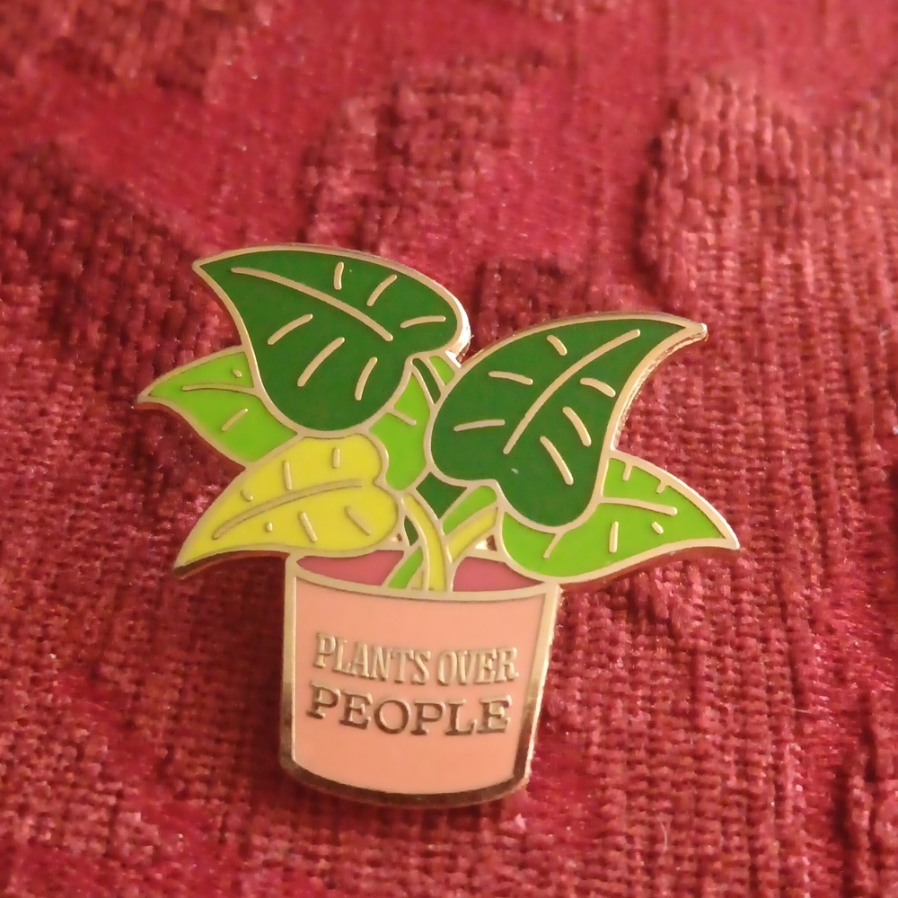 "Plants over people" pin